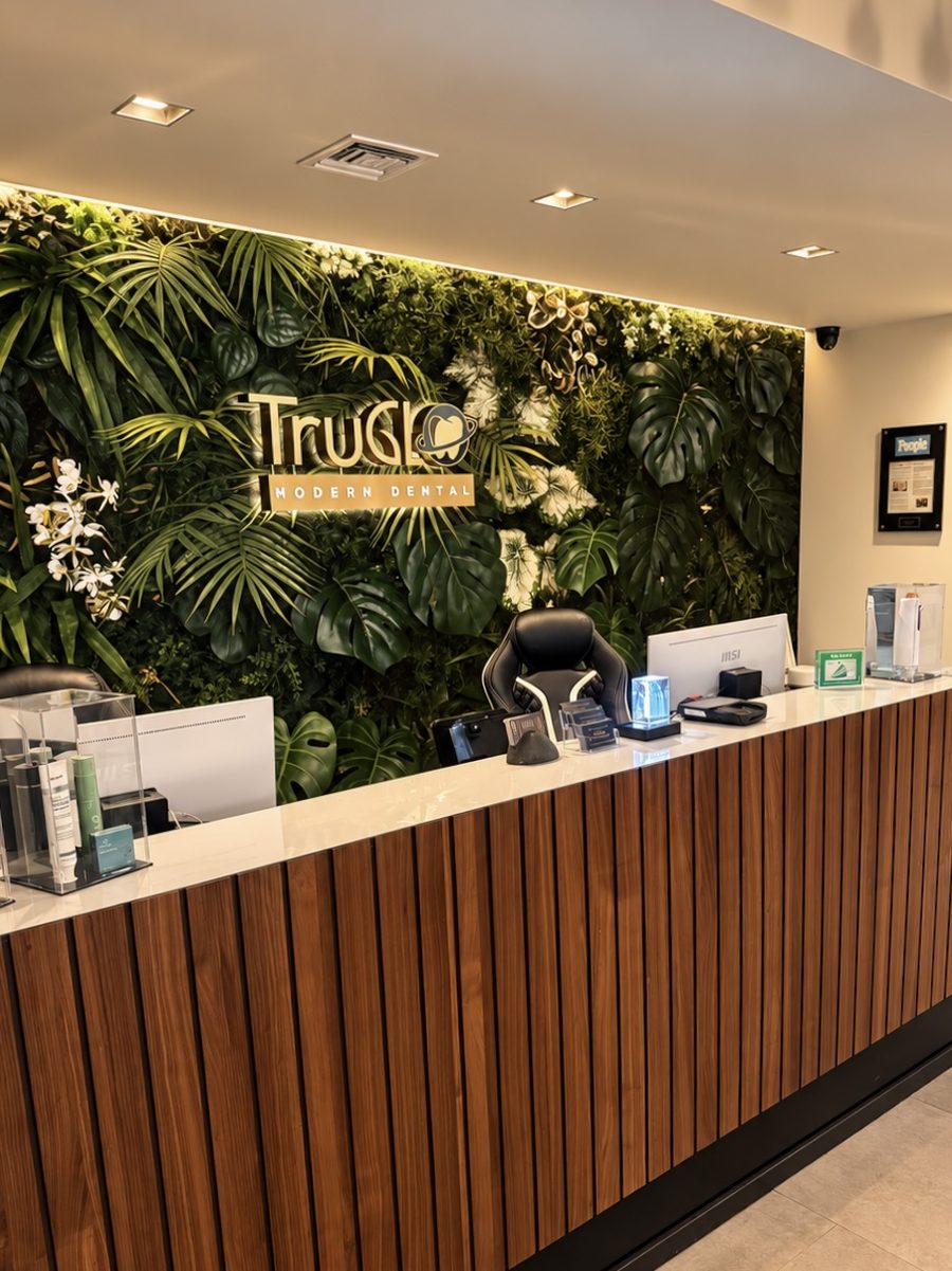 Reception desk with a living plant wall at TruGlo Calabasas